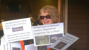 Myra Bonhage-Hale holds signs with questions she had for Console