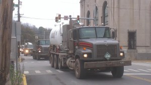 A convoy of fracking trucks pass through Weston