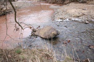 The stream on the left was polluted by runoff from fracking operations.  Photo courtesy of Ed Wade Jr. and Wetzel County Action Group